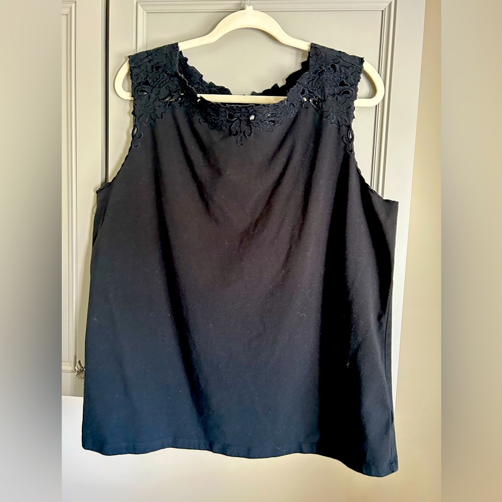 Black sleeveless cotton top with pretty cutouts around the neckline